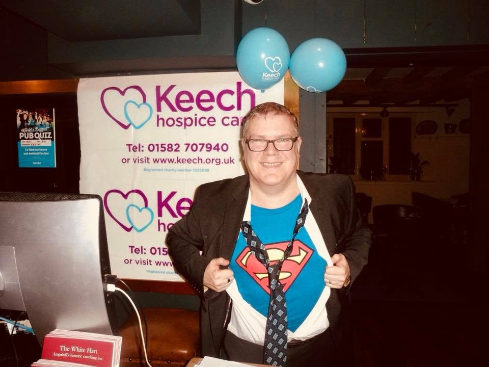 Quiz winners celebrating with cash prizes at an MK Pub Entertainment event